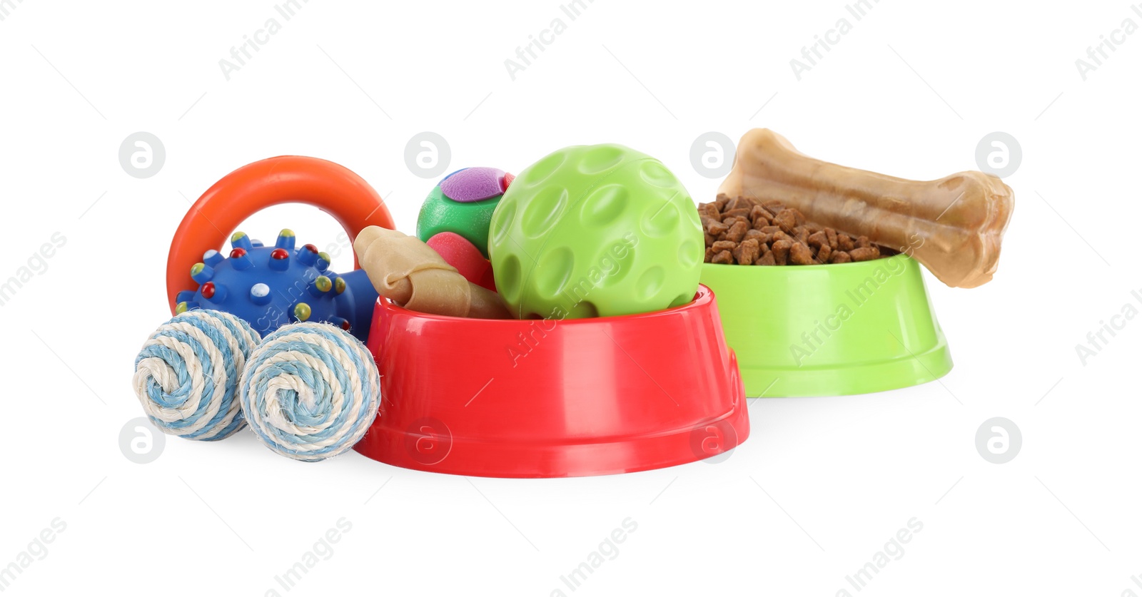 Photo of Various pet toys, food and bowl on white background