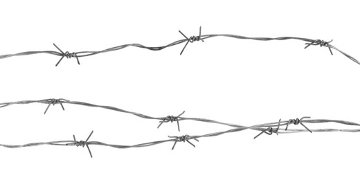 Photo of Shiny metal barbed wire isolated on white