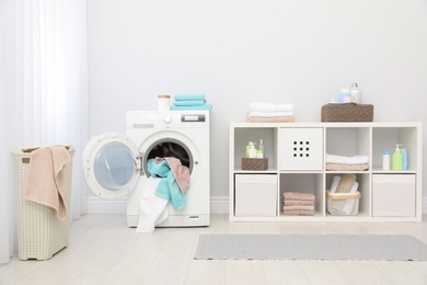 Bathroom interior with towels and washing machine