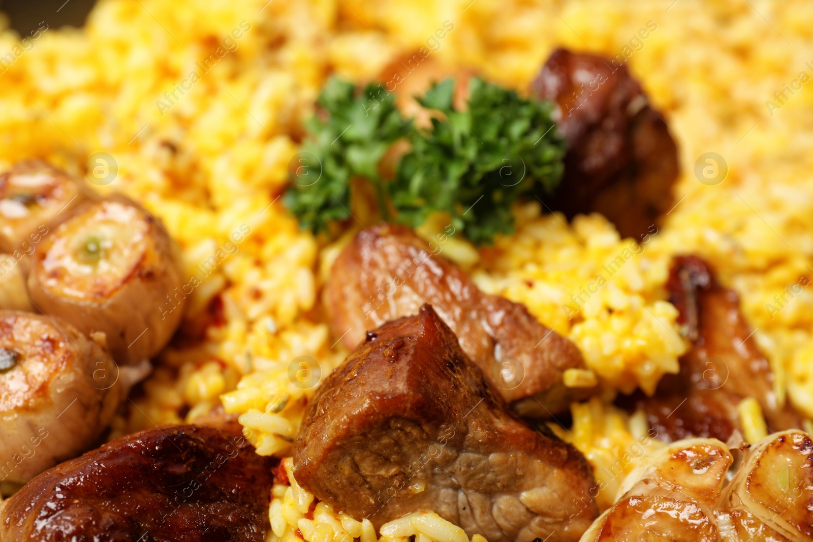 Photo of Delicious rice pilaf with meat as background, closeup