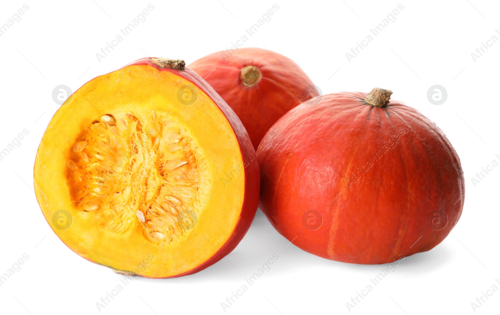 Photo of Many whole and cut ripe pumpkins on white background