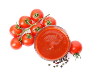 Photo of Glass of sauce, tomatoes and pepper isolated on white, top view