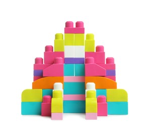 Castle made of colorful plastic blocks on white background