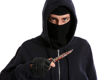 Man in mask with bloody knife on white background. Dangerous criminal