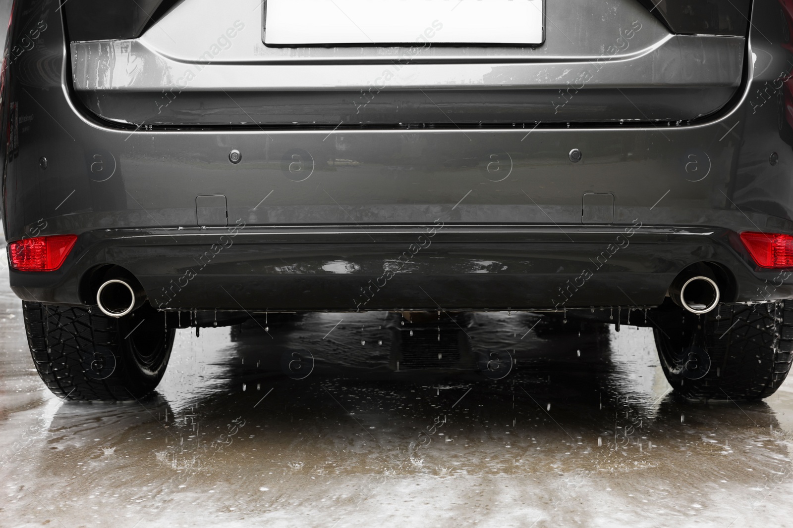 Photo of Black wet auto at car wash, closeup