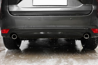 Photo of Black wet auto at car wash, closeup