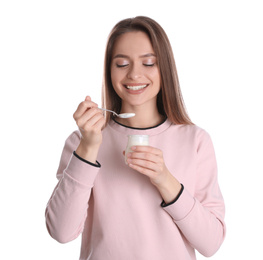 Photo of Young attractive woman with tasty yogurt on white background