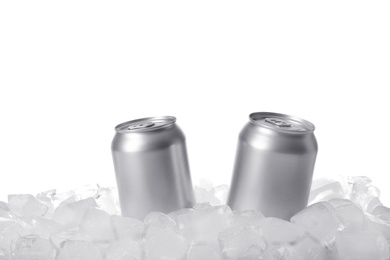 Photo of Tin cans on ice cubes against white background