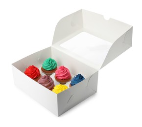 Photo of Box with different cupcakes on white background