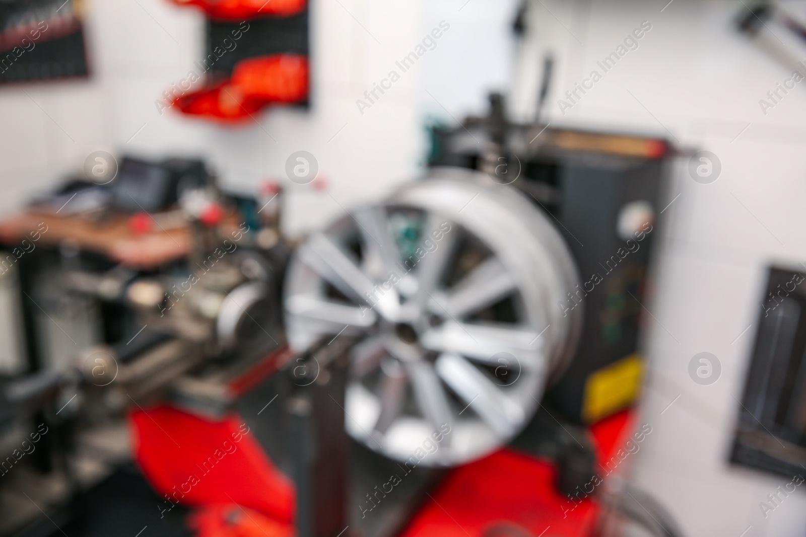 Photo of Blurred view of modern tire service station