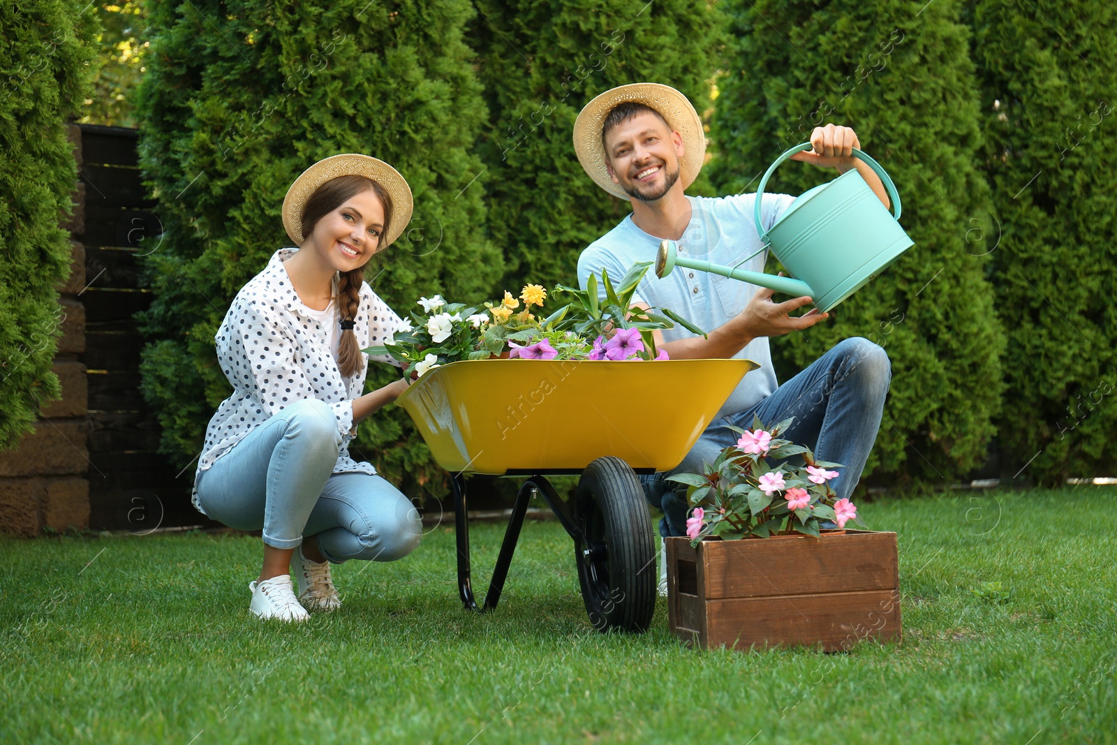 Photo of Happy couple working together in green garden