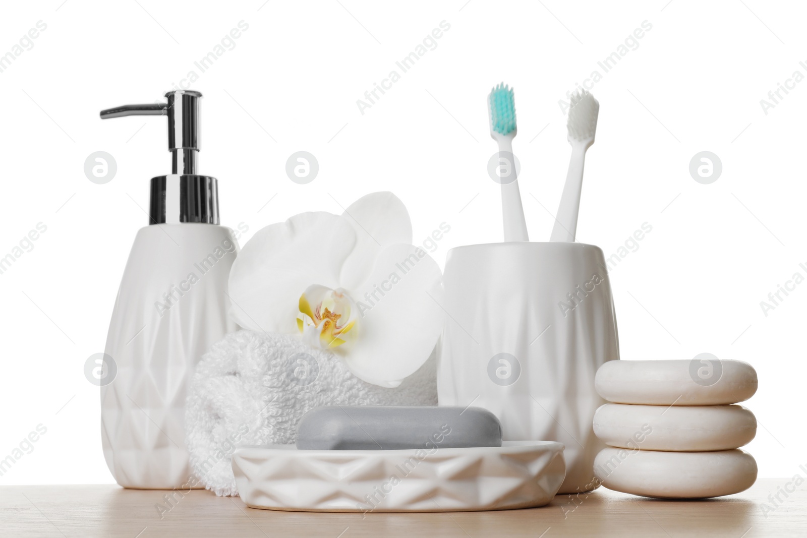 Photo of Bath accessories. Different personal care products and flower on wooden table against white background