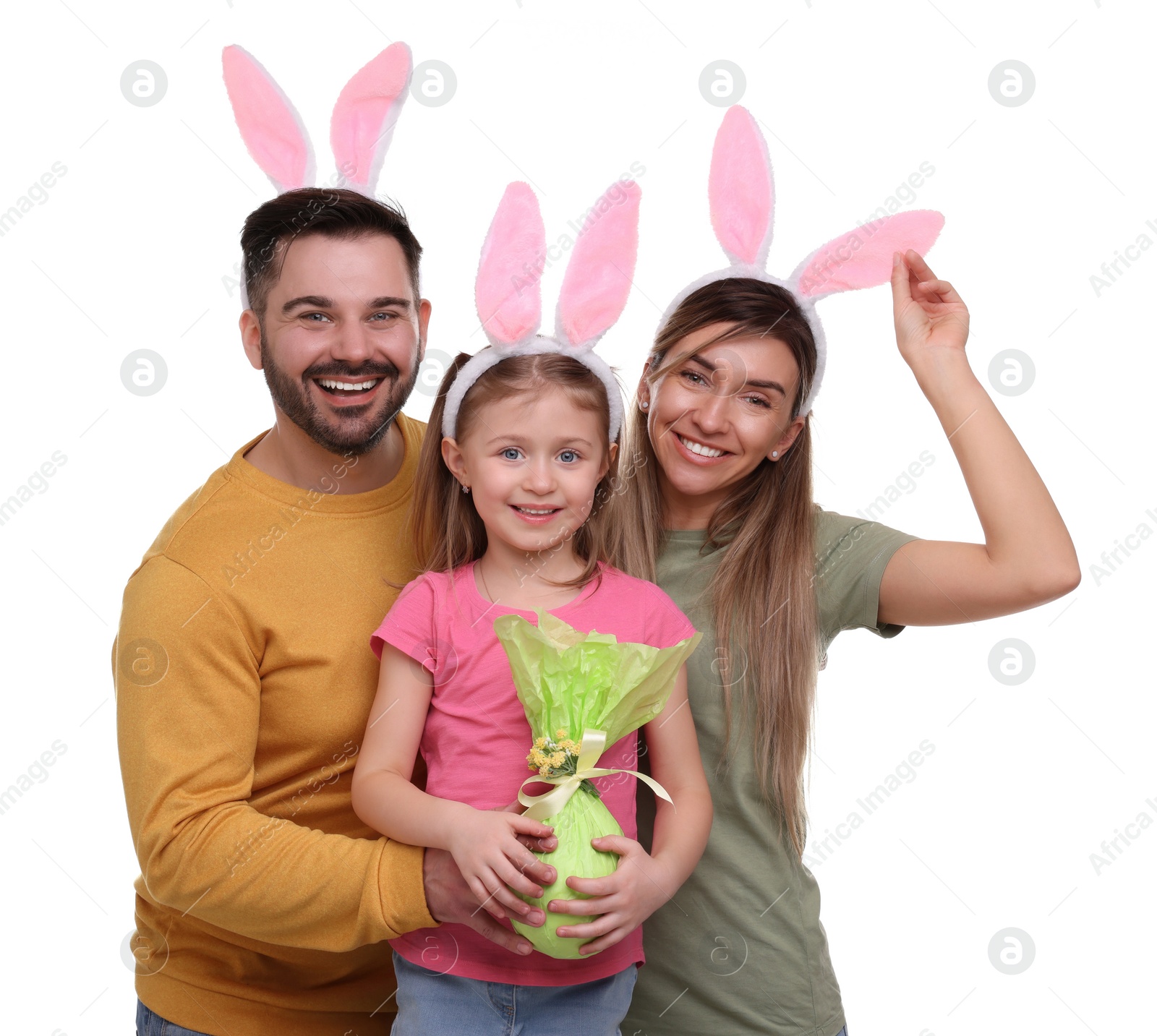 Photo of Easter celebration. Happy family with bunny ears and wrapped egg isolated on white