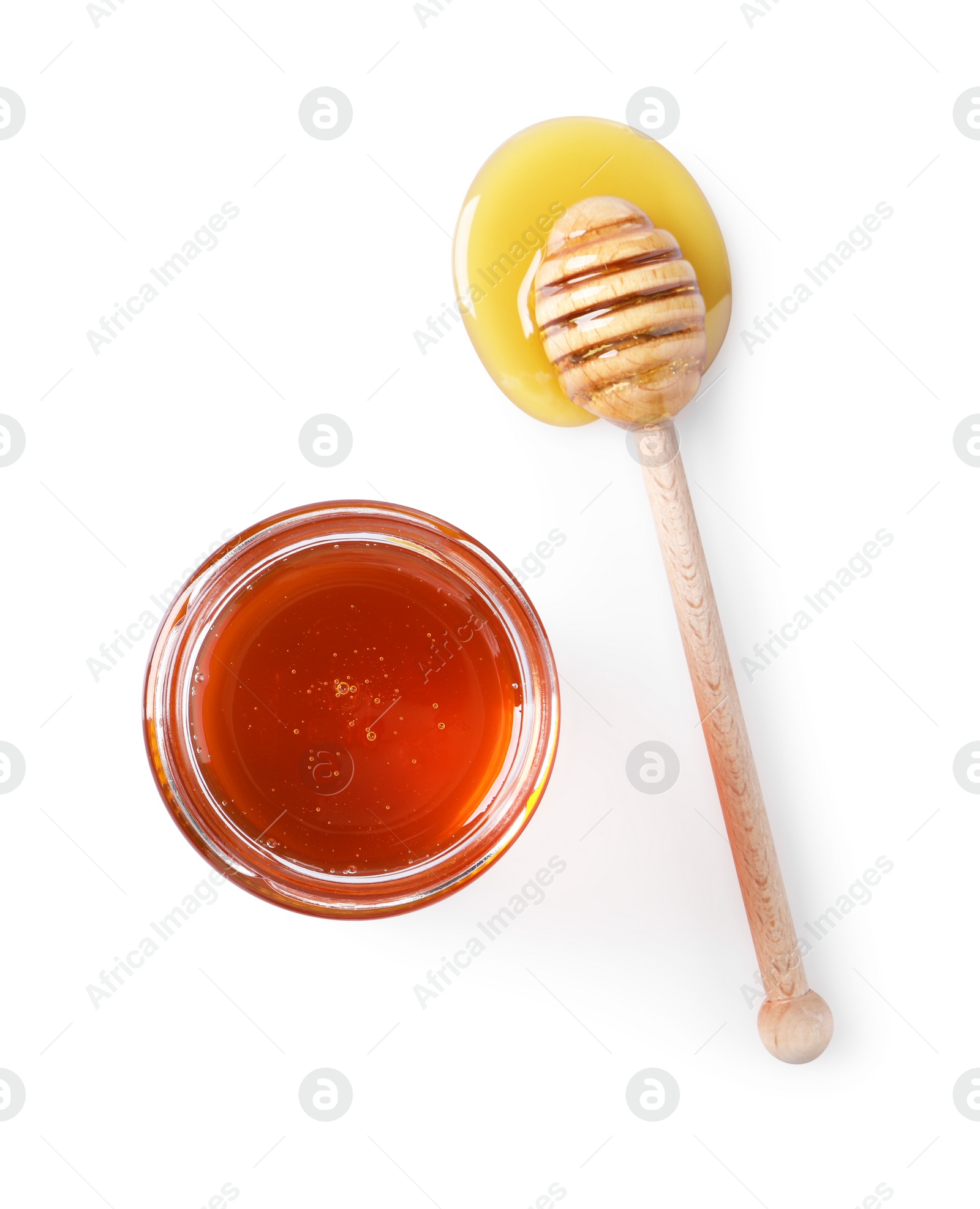 Photo of Tasty natural honey, glass jar and dipper on white background, top view