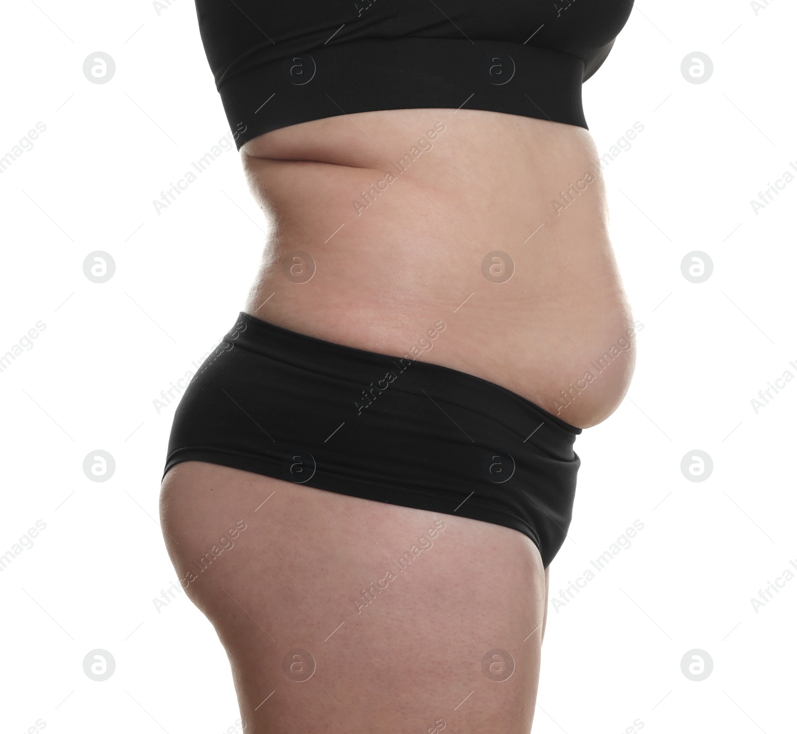 Photo of Woman with excessive belly fat on white background, closeup. Overweight problem