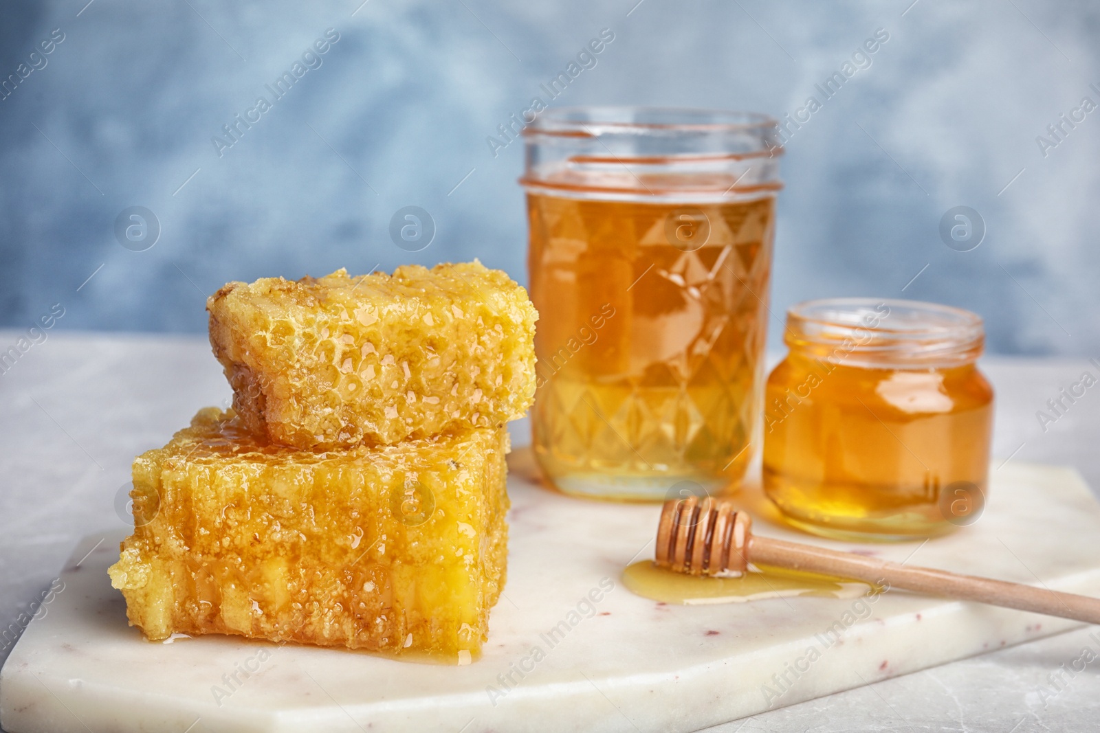 Photo of Composition with fresh honey on white board