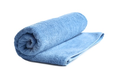 Photo of Rolled soft terry towel on white background