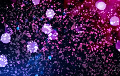 Image of Festive background with many beautiful shimmering stars and blurred lights. Bokeh effect
