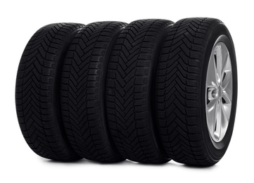 Photo of Set of wheels with winter tires on white background