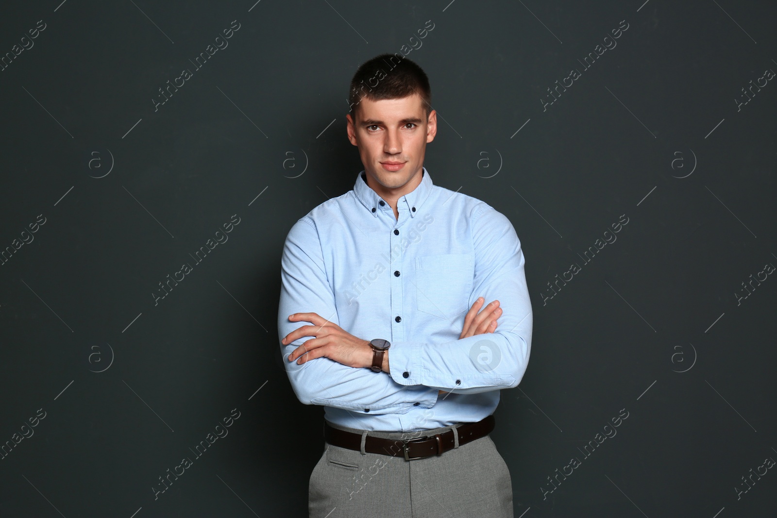 Photo of Portrait of handsome young man on dark background