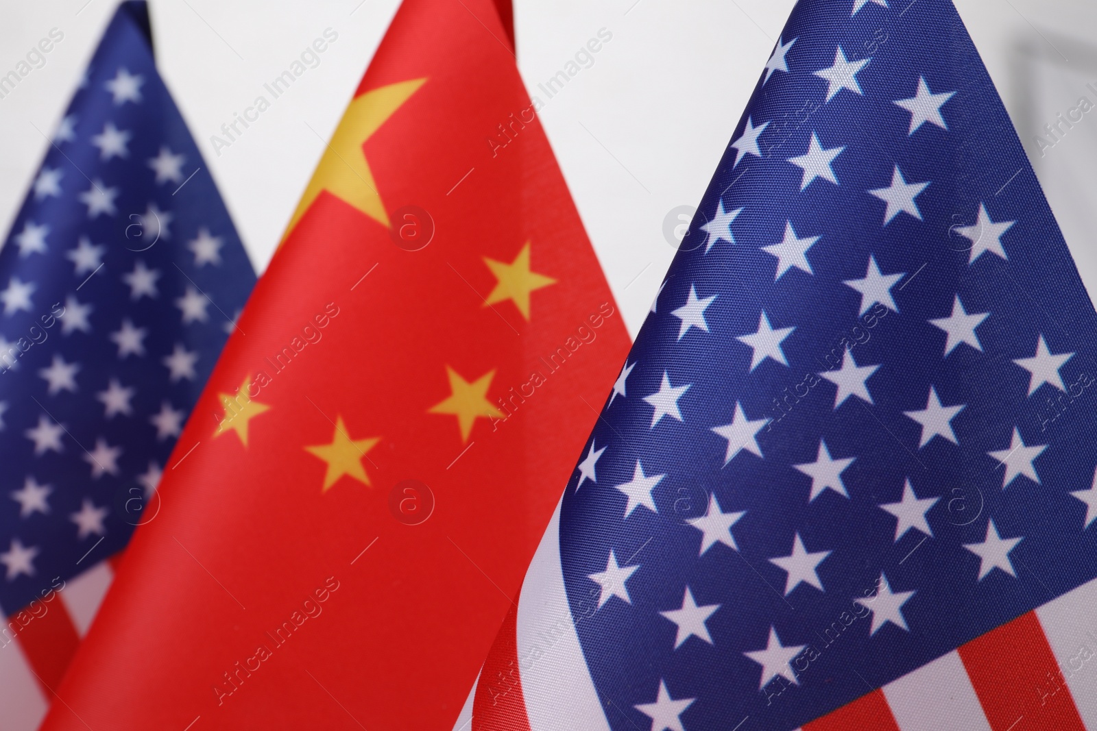 Photo of USA and China flags, closeup. International relations