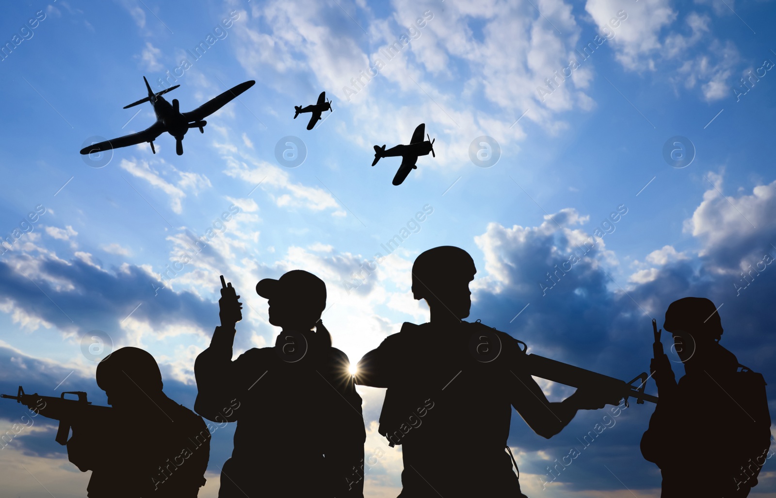 Image of Silhouettes of soldiers in uniform with assault rifles and military airplanes patrolling outdoors