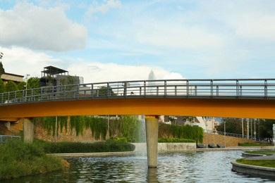 Photo of Beautiful view of bridge over pond with fontains in park