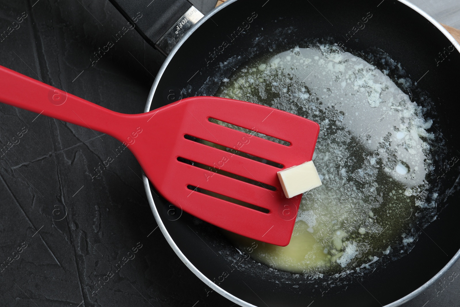 Photo of Melting butter in frying pan, top view