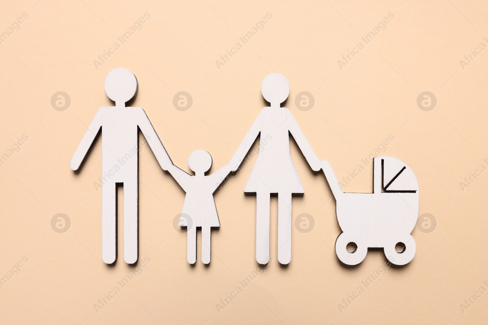 Photo of Figures of family on beige background, top view. Insurance concept