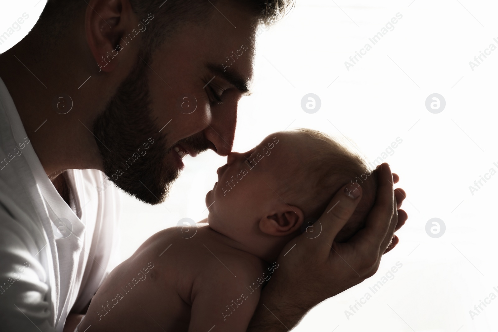 Image of Father with his newborn baby on white background, closeup view