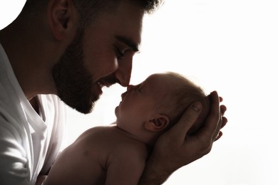 Image of Father with his newborn baby on white background, closeup view
