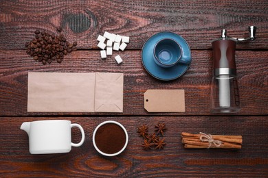 Photo of Flat lay composition with manual coffee grinder and spices on wooden background