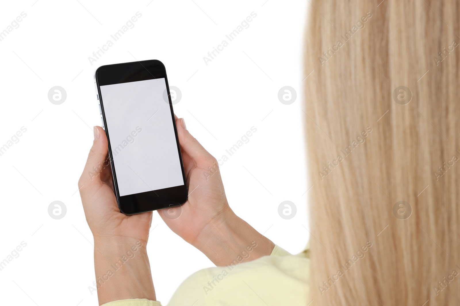 Photo of Woman holding smartphone with blank screen on white background, closeup. Mockup for design