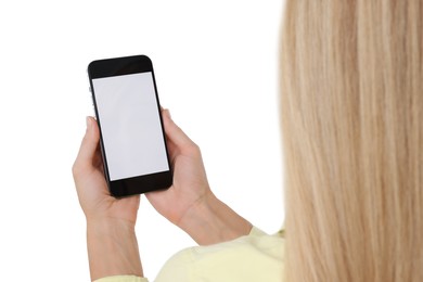 Woman holding smartphone with blank screen on white background, closeup. Mockup for design