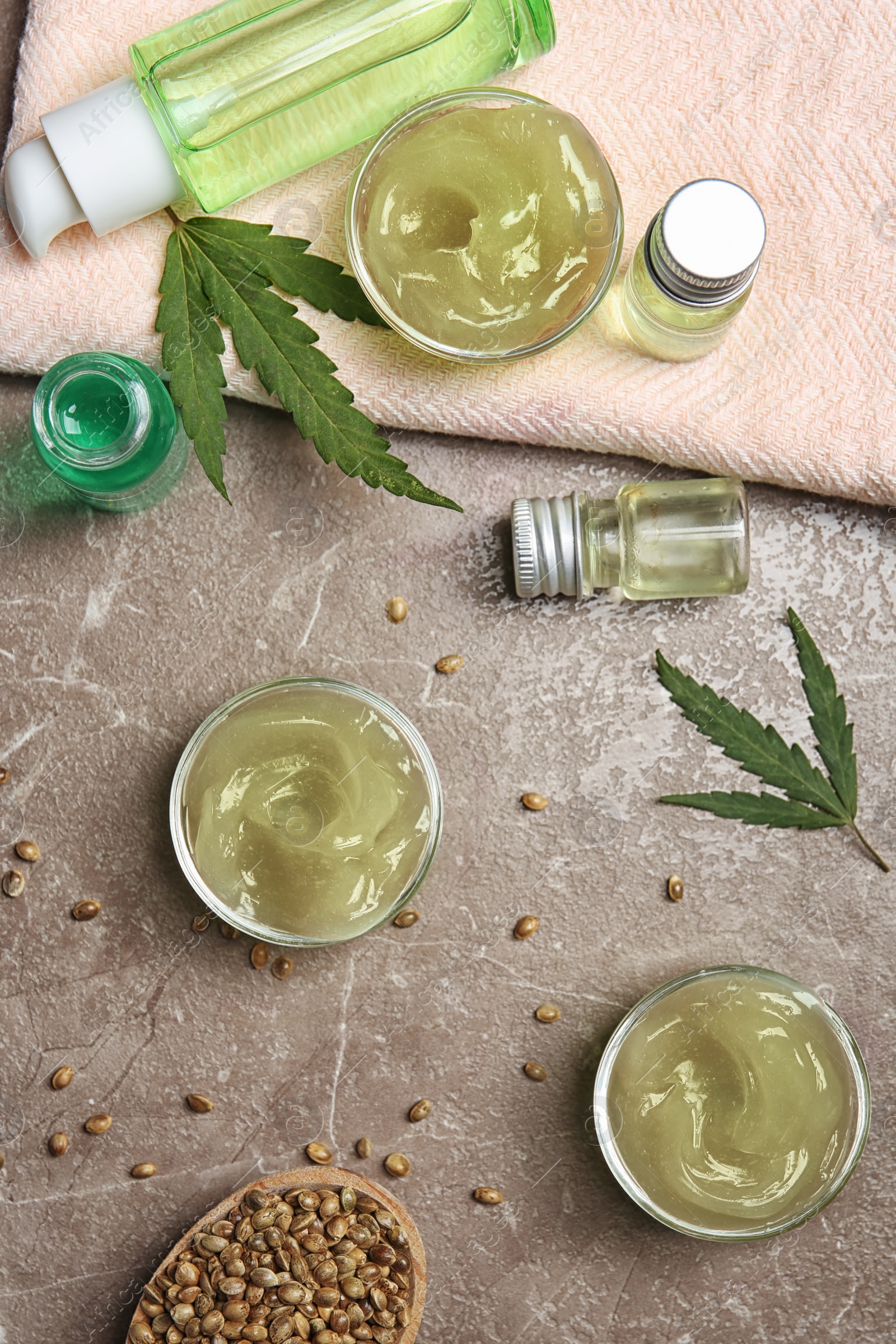 Photo of Flat lay composition with hemp lotion on grey background