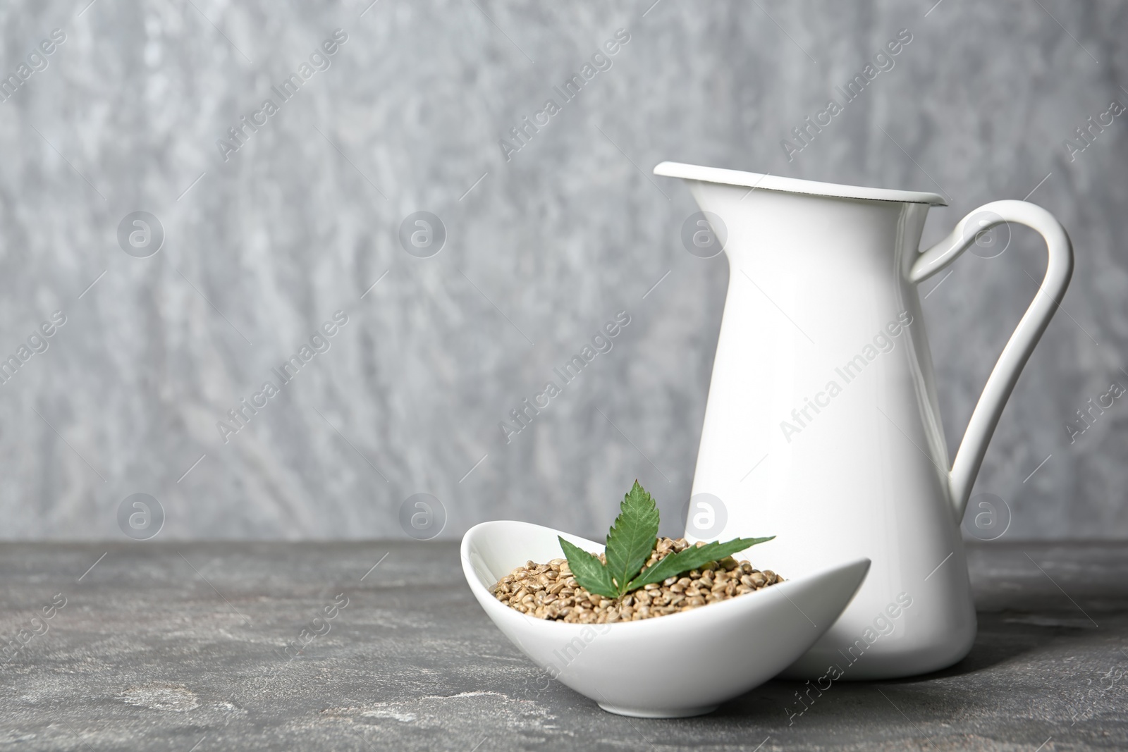 Photo of Composition with hemp milk and space for text on grey background
