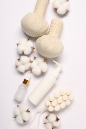 Bath accessories. Different personal care products and cotton flowers on white background, flat lay