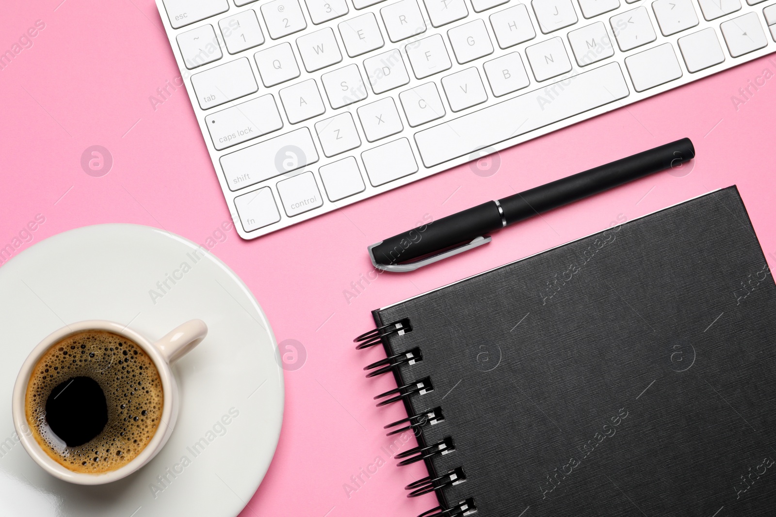 Photo of Flat lay composition with stylish notebook on pink background