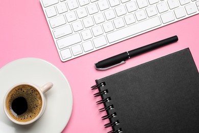 Flat lay composition with stylish notebook on pink background