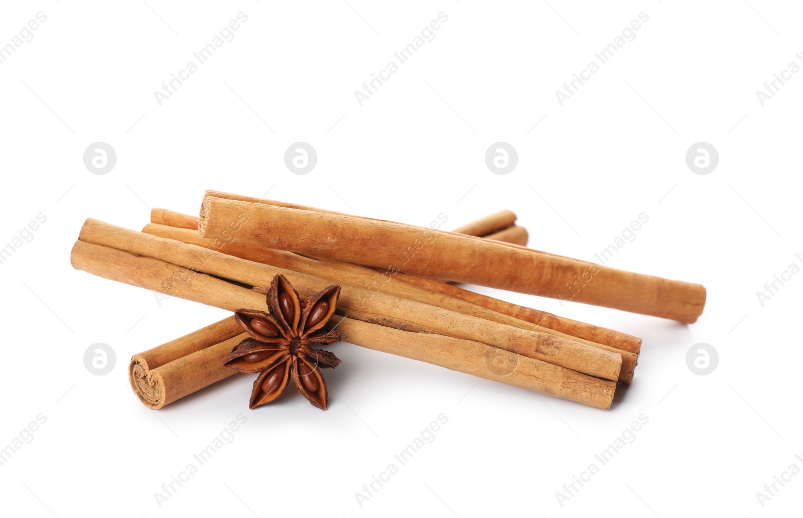 Photo of Aromatic cinnamon sticks and anise isolated on white