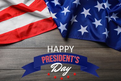 Image of Happy President's Day - federal holiday. American flag and text on wooden background, top view