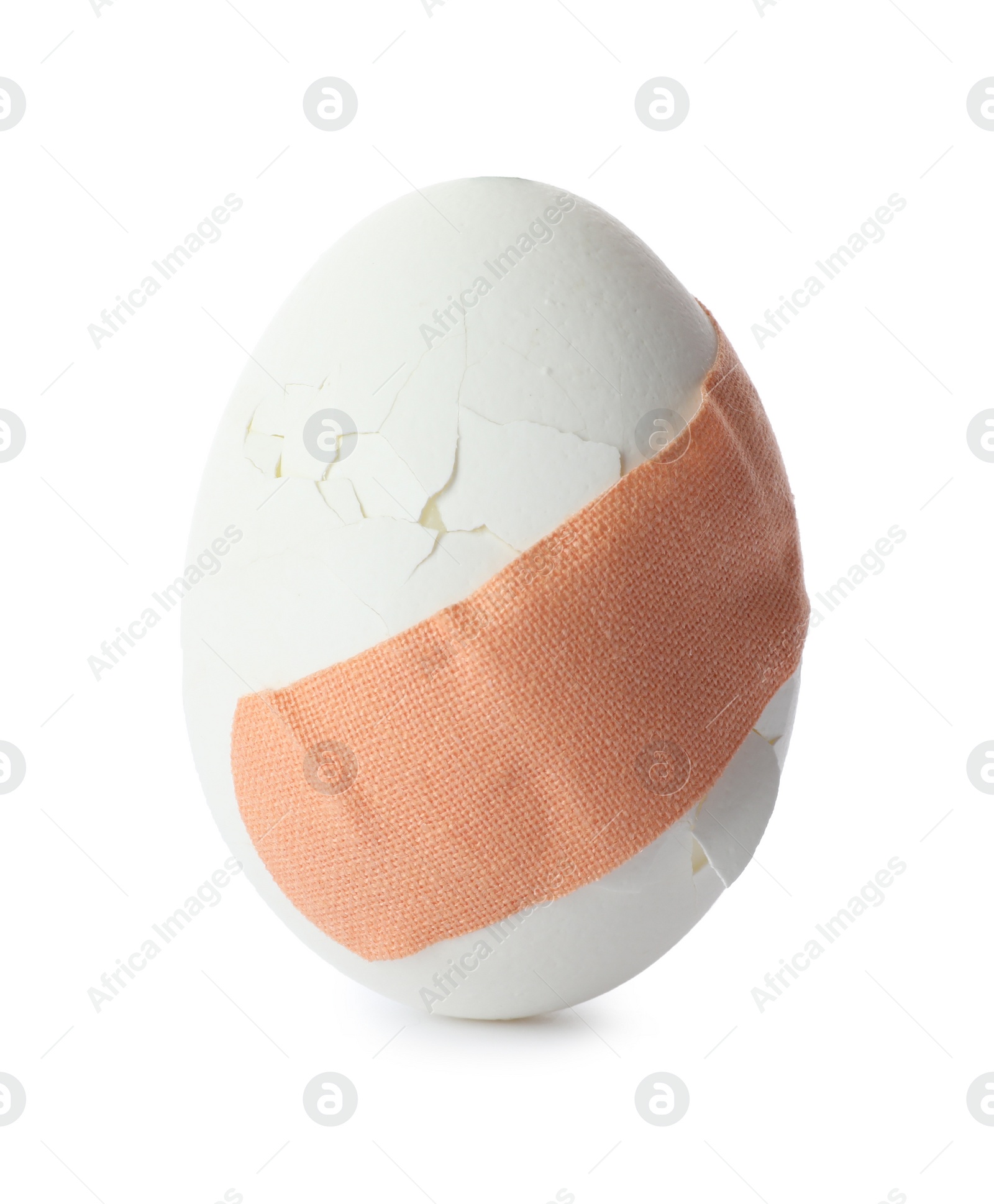Photo of Cracked egg with sticking plaster isolated on white