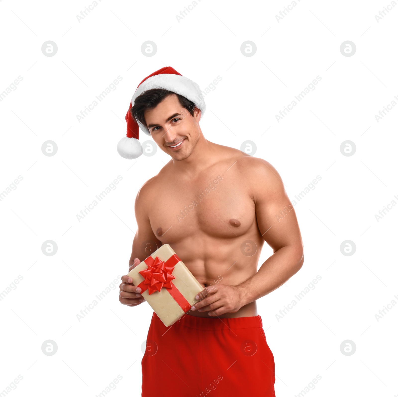 Photo of Sexy shirtless Santa Claus with gift on white background
