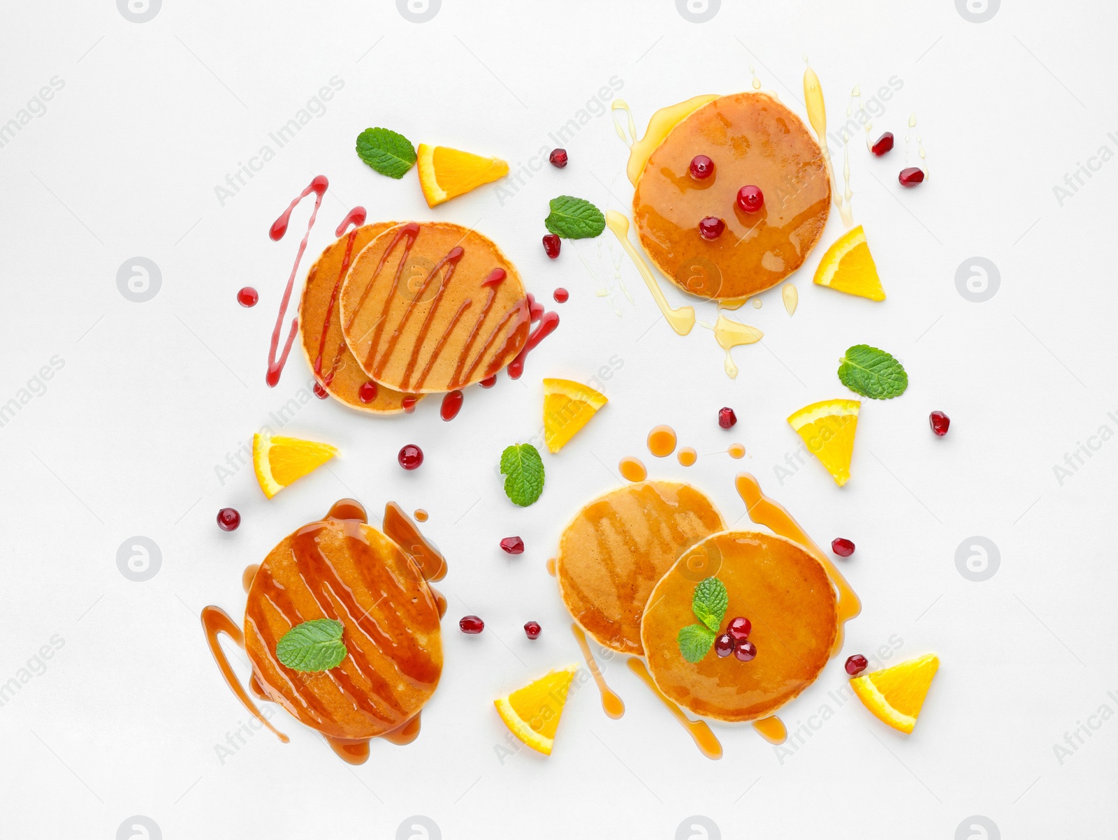 Photo of Delicious pancakes with fruits and jam on white background