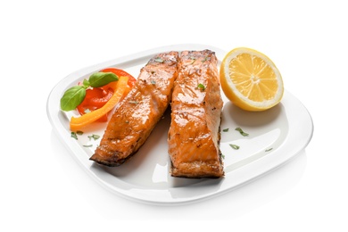 Plate with tasty cooked salmon on white background