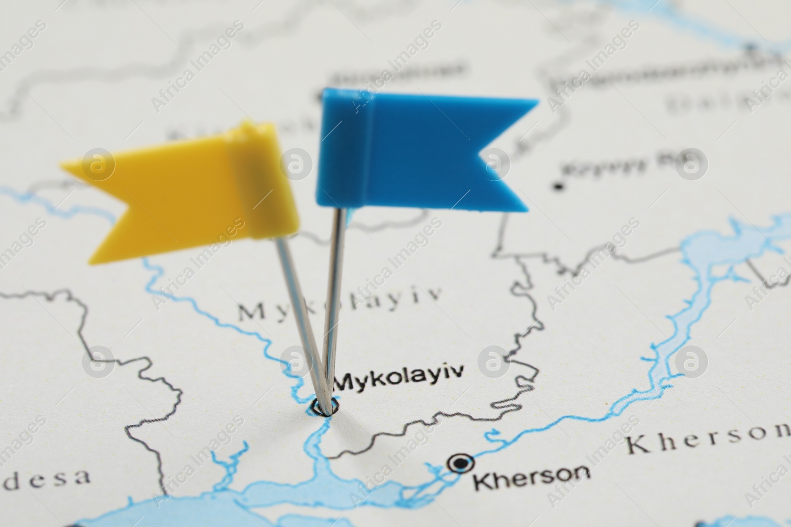 Photo of MYKOLAIV, UKRAINE - NOVEMBER 09, 2020: Mykolaiv city marked with push pins on contour map of Ukraine, closeup