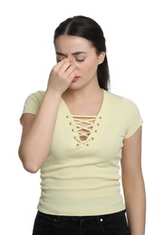 Young woman suffering from cold on white background