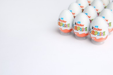 Sveti Vlas, Bulgaria - June 26, 2023: Kinder Surprise Eggs in plastic tray on white background. Space for text