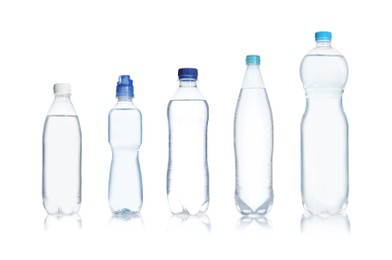 Set with different bottles of pure water on white background 
