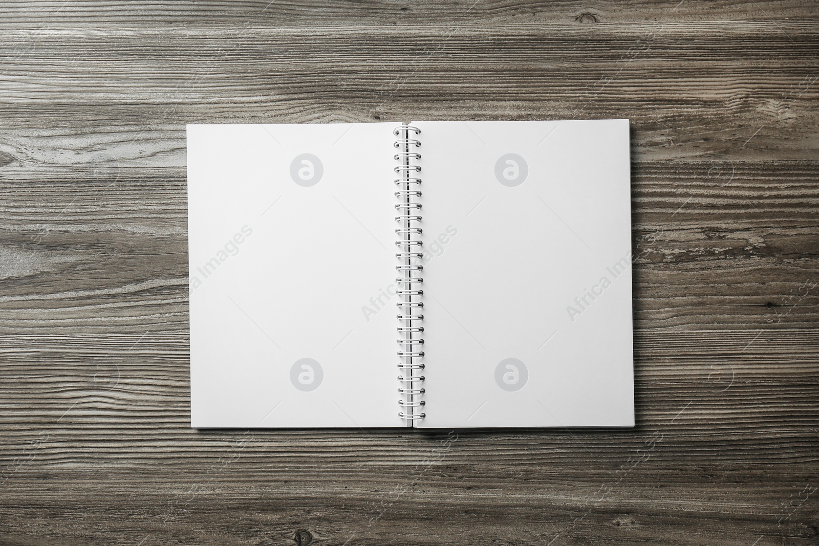 Photo of Blank paper brochure on wooden table, top view. Mockup for design